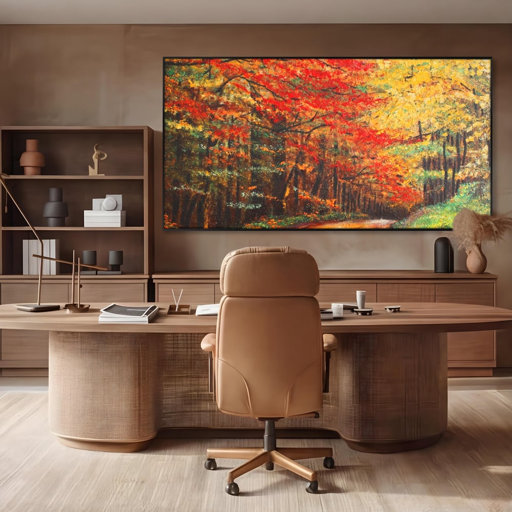 Tablou canvas cu pictura peisaj cu drum prin padure toamna, in rama de aluminiu negru, pe perete intr-un birou